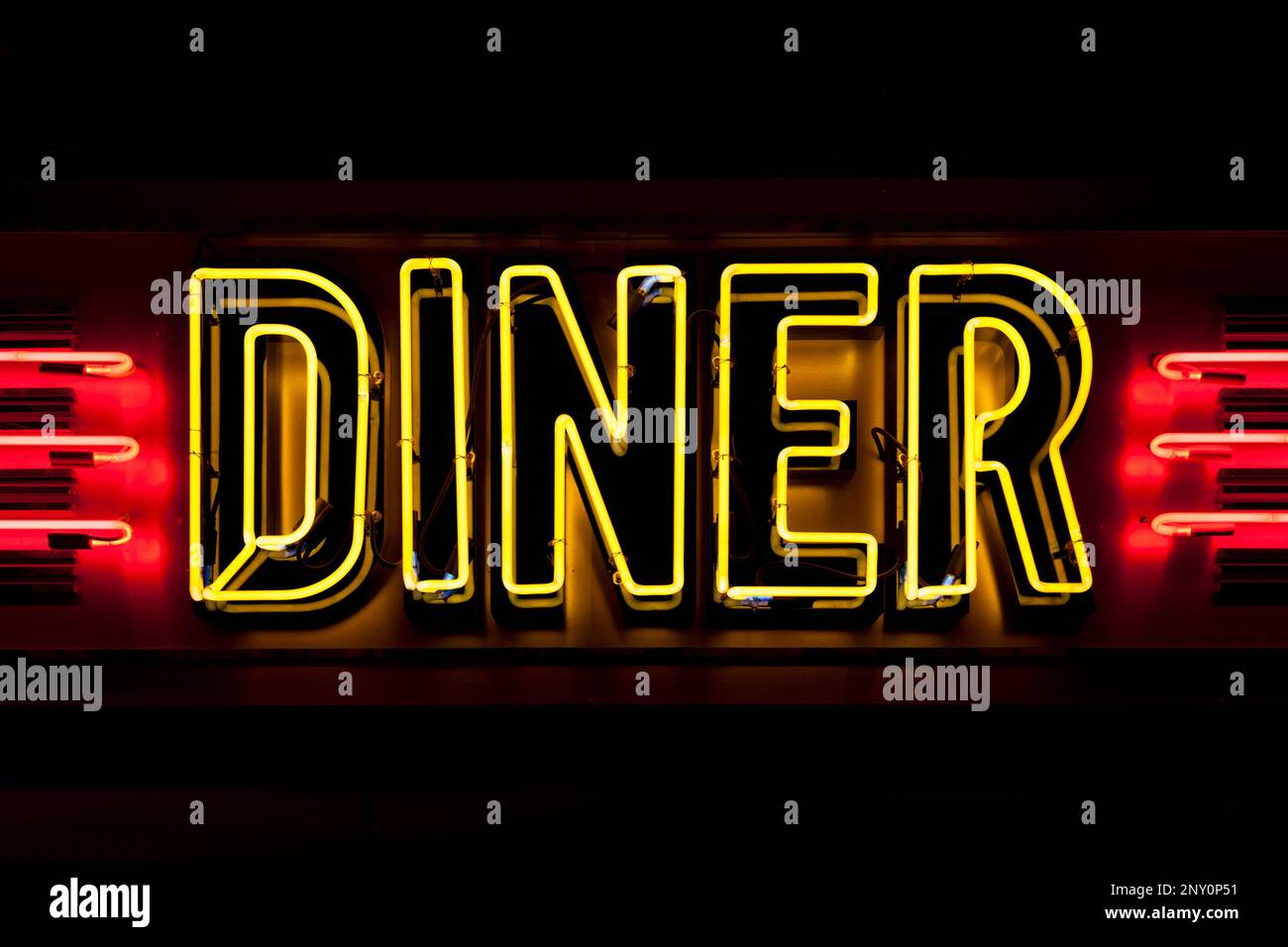 Close-up on a neon light shaped into the word 'Diner'. Stock Photo
