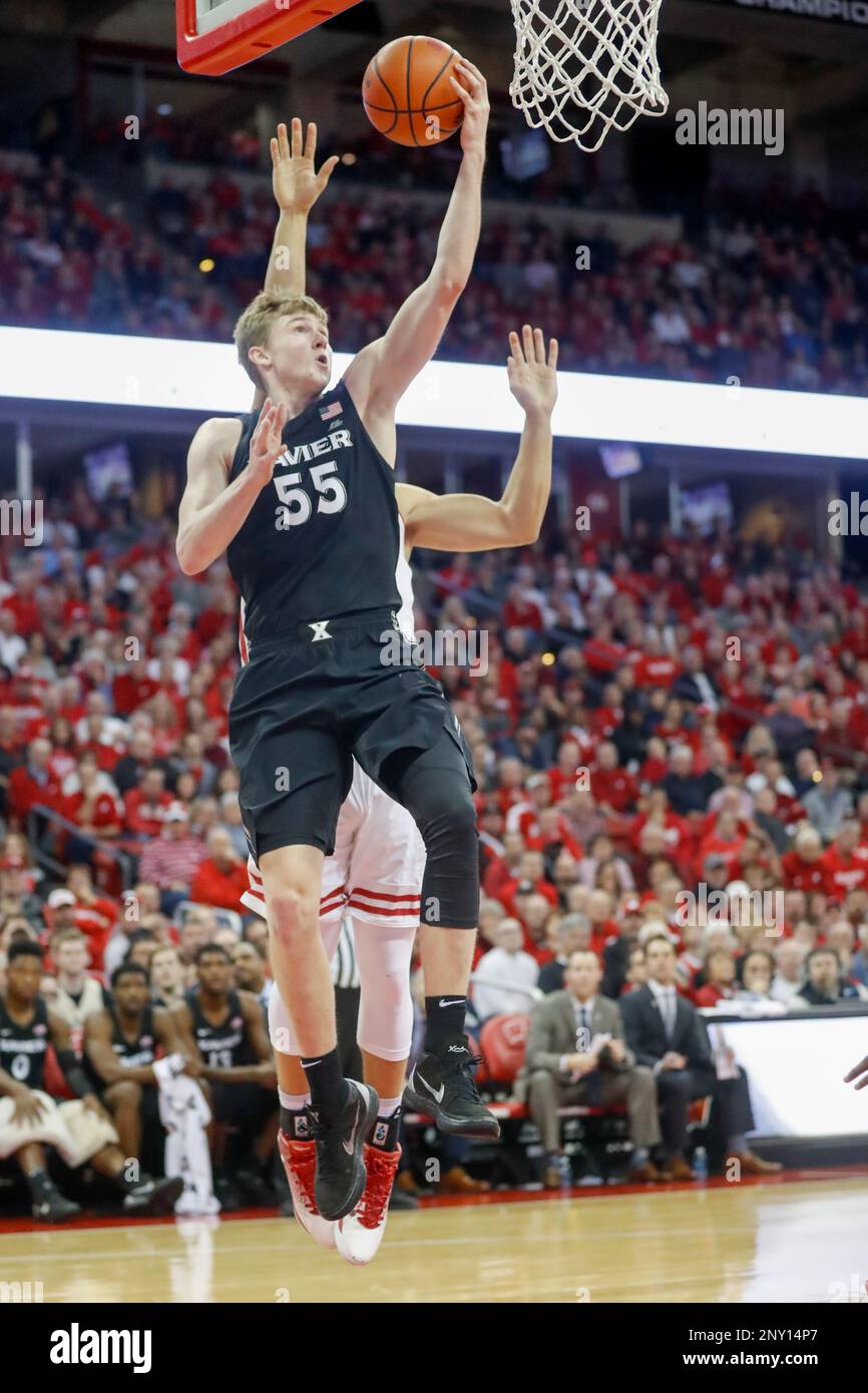 MADISON, WI - NOVEMBER 16: Xavier Guard J.P. Macura (55) goes up for a lay  up during a college basketball game between the University of Wisconsin  Badgers and the Xavier University Musketeers