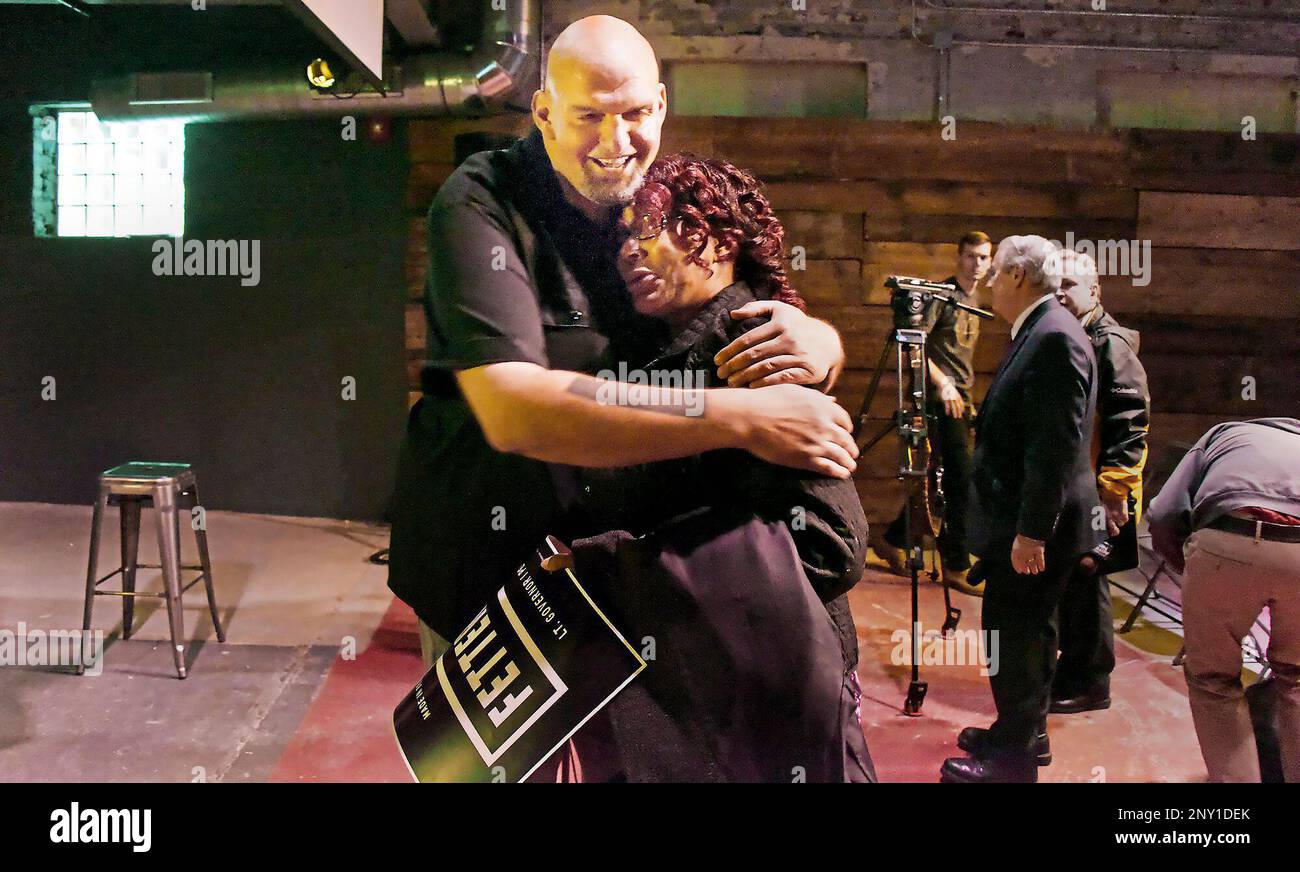 Progressive Braddock Mayor John Fetterman laughs and gives Delia Lennon