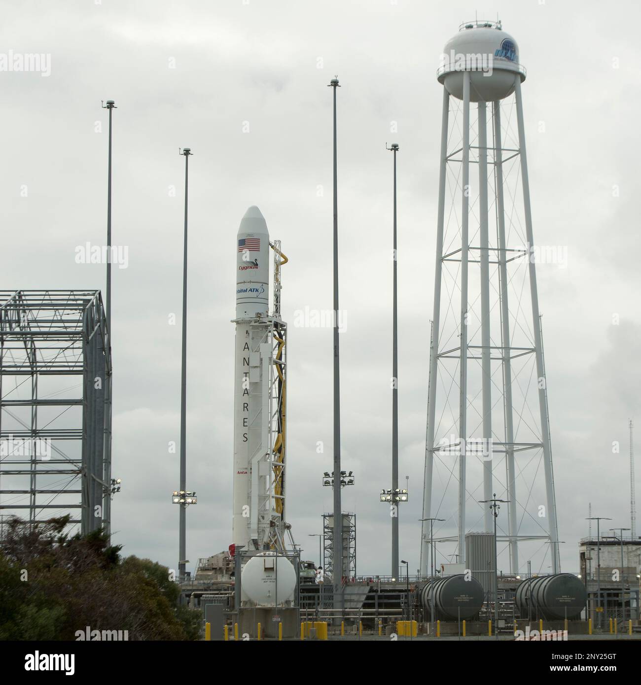 This photo provided by NASA shows the Orbital ATK Antares rocket, with the Cygnus spacecraft onboard, on launch Pad-0A, Thursday, Nov. 9, 2017 at NASA's Wallops Flight Facility in Wallops Island, Va. The Orbital ATK's eighth contracted cargo resupply mission will deliver over 7,400 pounds of science and research, crew supplies and vehicle hardware to the orbital laboratory and its crew at the International Space Station. (NASA/Bill Ingalls/NASA via AP) Stock Photo