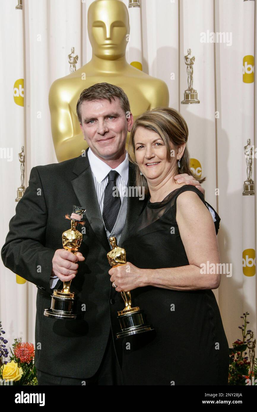 Production designer Robert Stromberg (L) and set decorator Karen O'Hara, winners of the award for Outstanding Achievement in Art Direction for 'Alice in Wonderland', pose in the press room during the 83rd Annual Academy Awards held at the Kodak Theatre on February 27, 2011 in Hollywood, California. Photo by Francis Specker Stock Photo