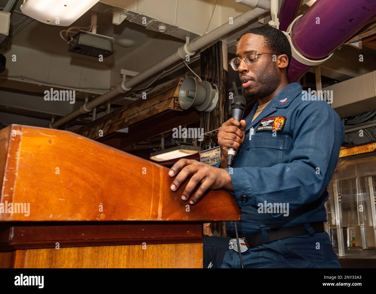 230218-N-MH015-1011 SOUTH CHINA SEA (Feb. 18, 2023) U.S. Navy Aviation Electronics Technician 2nd Class Alexander Amerson, from Columbus, Ga., speaks at a Black History Month celebration in the aft mess decks aboard the aircraft carrier USS Nimitz (CVN 68). Nimitz is in U.S. 7th Fleet conducting routine operations. 7th Fleet is the U.S. Navy's largest forward-deployed numbered fleet, and routinely interacts and operates with Allies and partners in preserving a free and open Indo-Pacific region. Stock Photo