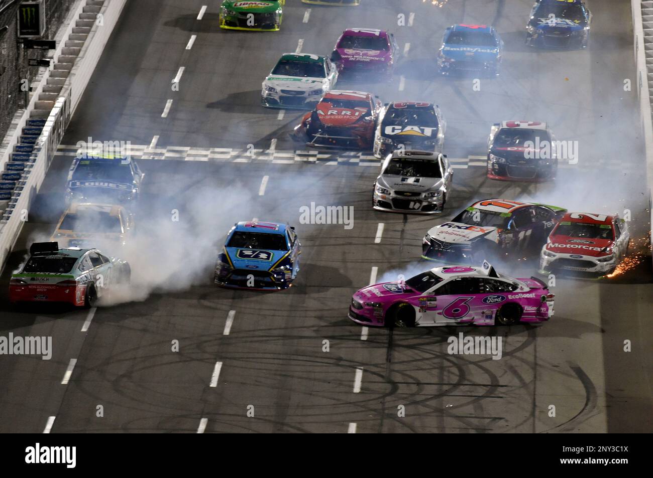 Kevin Harvick (4) and Denny Hamlin (11) wreck during the NASCAR Monster