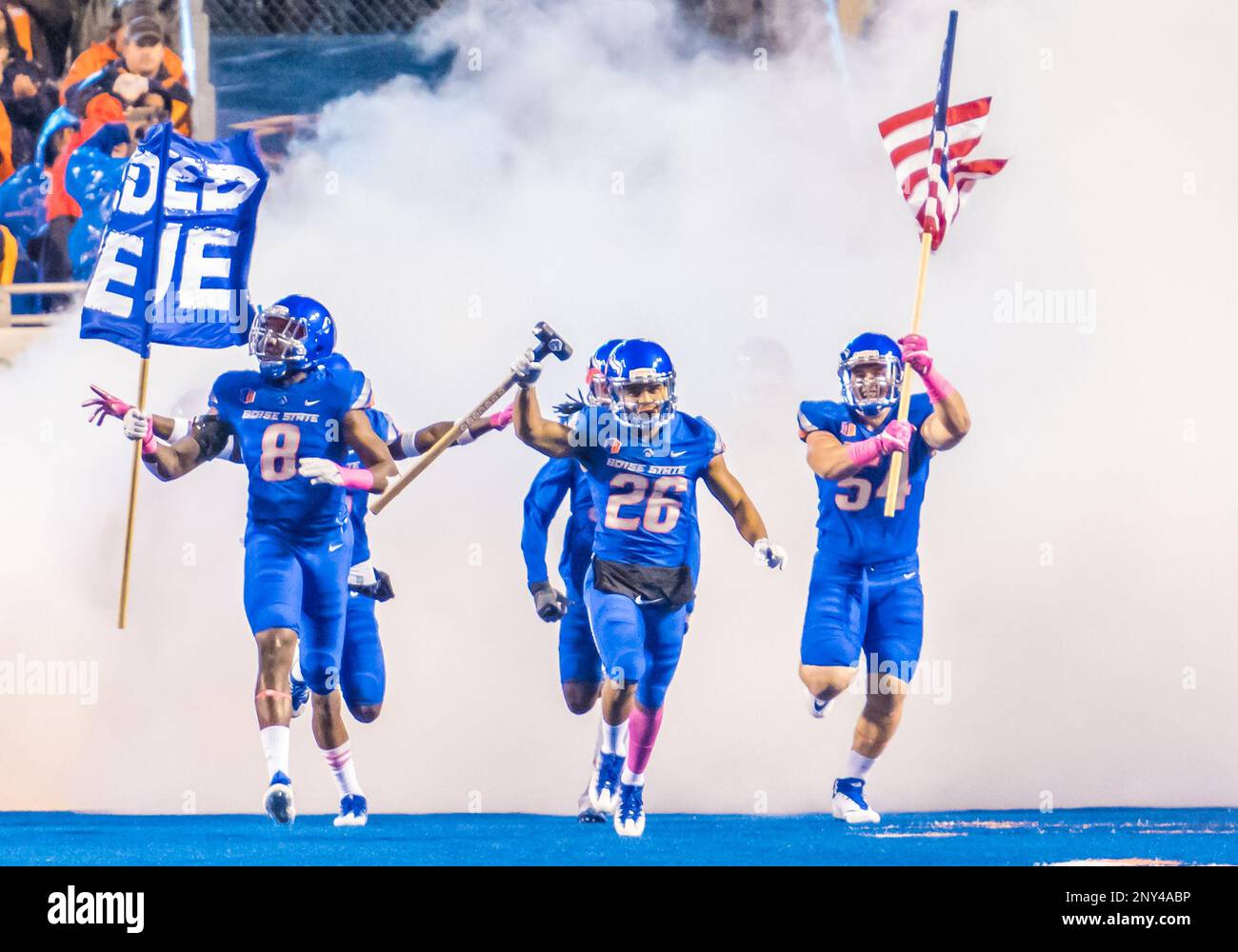 BOISE, ID - OCTOBER 21: Boise State Broncos cornerback Avery Williams (26)  leads his teammates onto the field with 'the hammer' during the regular  season game between the Wyoming Cowboys verses the