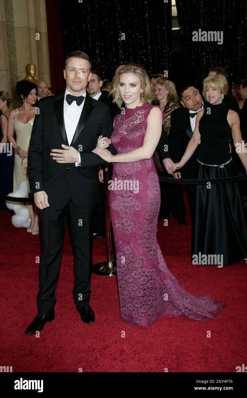Actress Scarlett Johansson (R) and agent Joe Machota arrive at the 83rd Annual Academy Awards held at the Kodak Theatre on February 27, 2011 in Los Angeles, California. Photo by Francis Specker Stock Photo