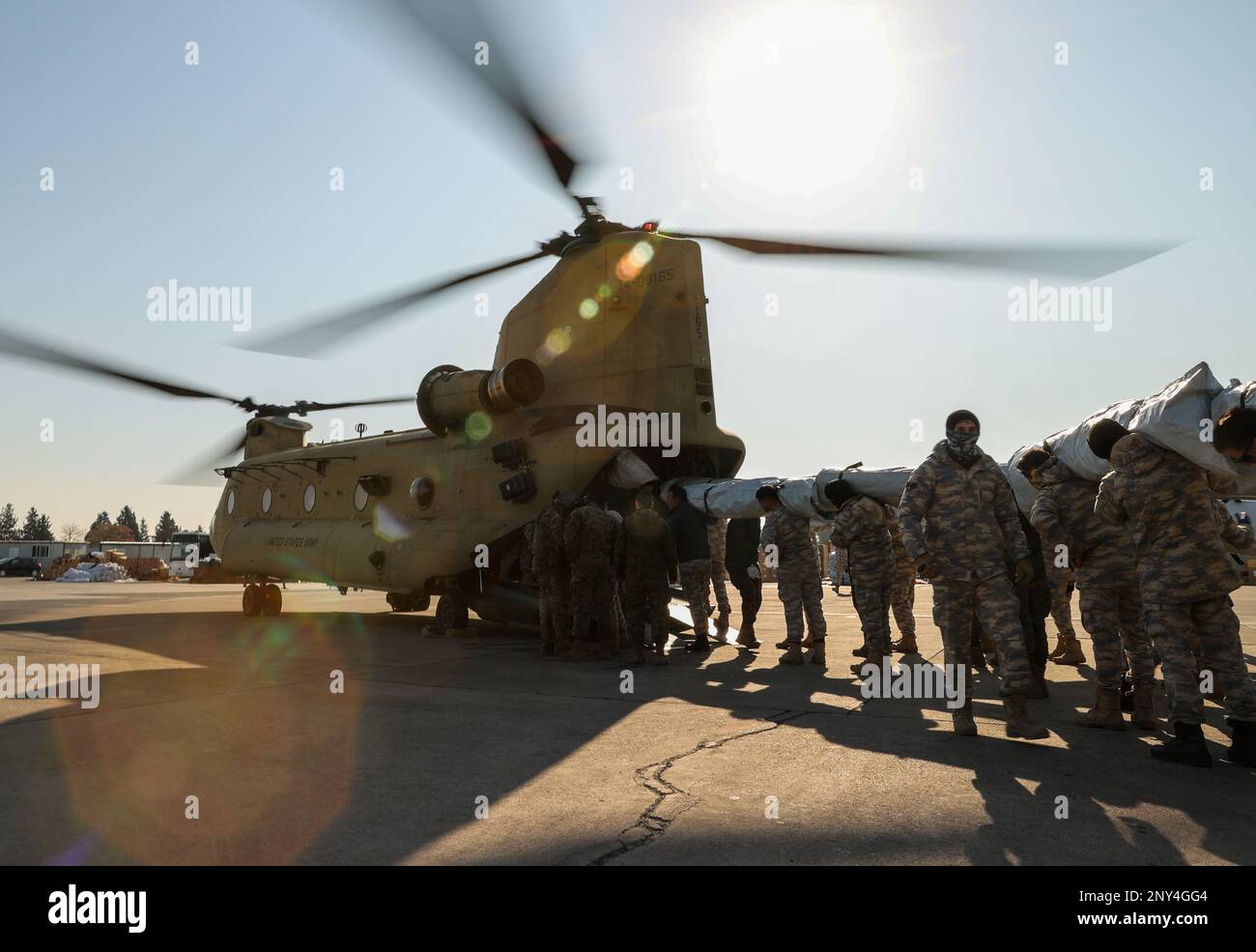 Members of the Turkish Air Force transport aid (tents) to the CH-47 ...