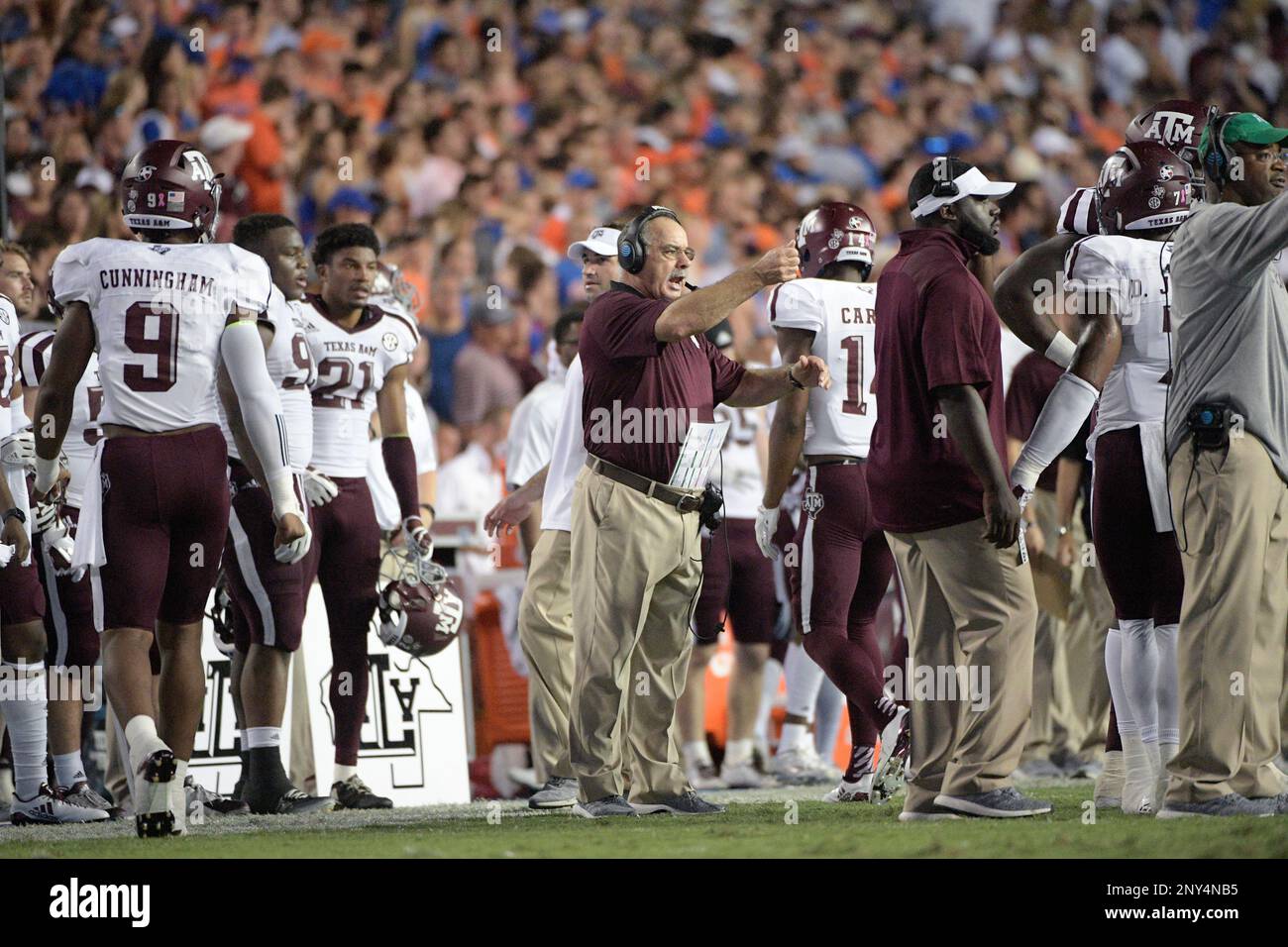 Texas A&M defensive coordinator John Chavis, center, calls out from the sideline during the first half of an NCAA college football game against Florida Saturday, Oct. 14, 2017, in Gainesville, Fla. (Phelan M. Ebenhack via AP) Stock Photo