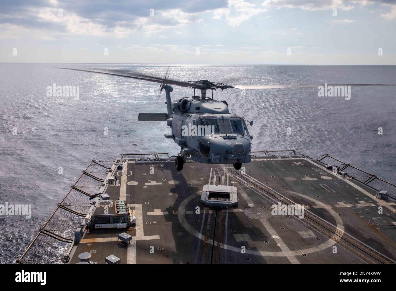 230213-N-EH998-1019 AEGEAN SEA (Feb. 13, 2023) An MH-60R Seahawk helicopter, attached to Helicopter Maritime Strike Squadron (HSM) 48, lands on the Arleigh Burke-class guided-missile destroyer USS Nitze (DDG 94), Feb. 13, 2023. The George H.W. Bush Carrier Strike Group is on a scheduled deployment in the U.S. Naval Forces Europe area of operations, employed by U.S. Sixth Fleet to defend U.S., allied, and partner interests. (U.S. Navy photo by Mass Communication Specialist 2nd Class Cryton Vandiesal) Stock Photo