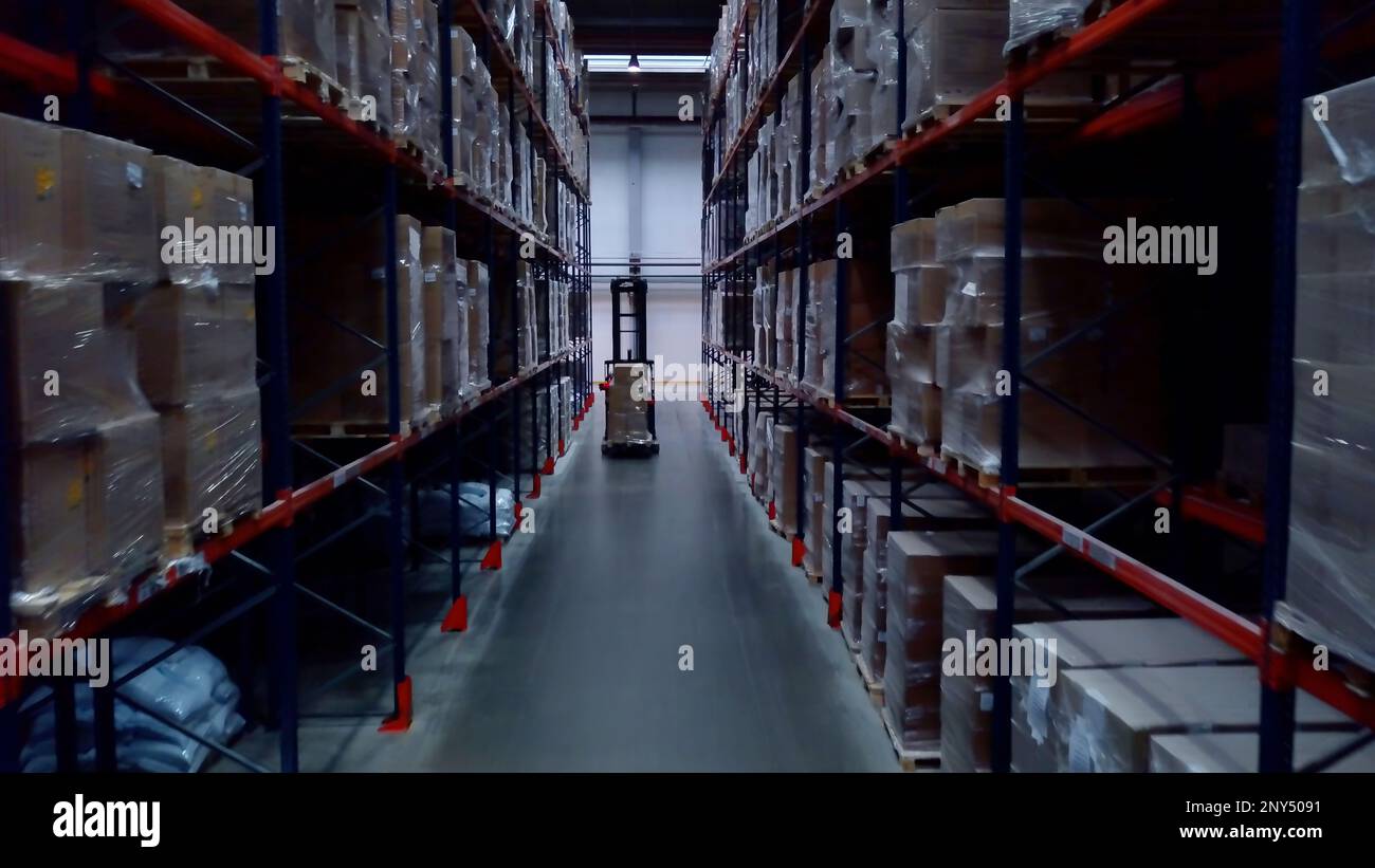 Huge shelves located close to each other. Creative. Long with shelves with parcels that