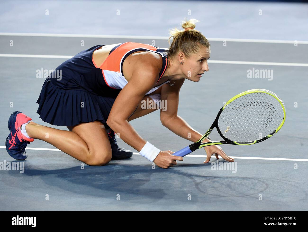 Monique Adamczak of Australia reacts as she and Chang Kai-Chen of Chinese  Taipei compete against Lu Jiajing and Wang Qiang of China in their  semifinal match of women's doubles during 2017 WTA