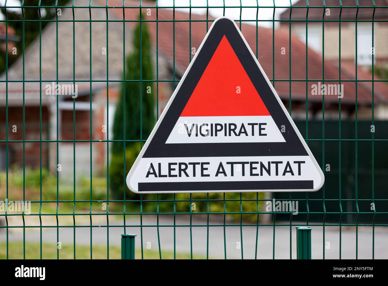 Triangular sign attached to a school fence for the Vigipirate plan, the France's national security alert system against terrorist threats. Stock Photo