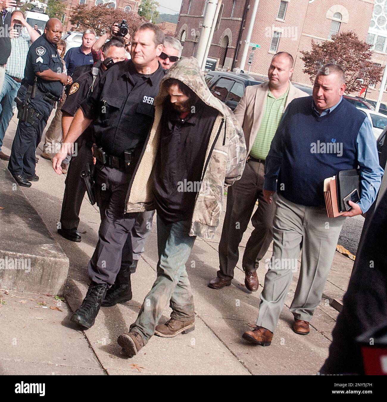 Suspect Arron Lawson, center, is escorted into the Lawrence County ...