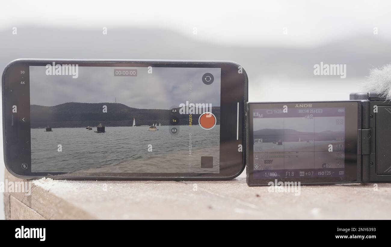 Turkey, Istanbul August 10, 2022 Comparing videos on phone and
