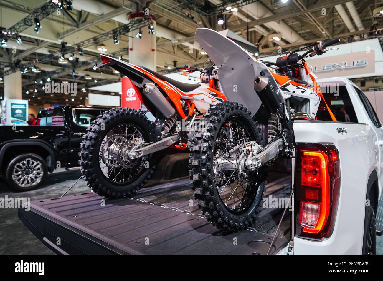 Two off road dirt bikes on the back of a truck Stock Photo Alamy