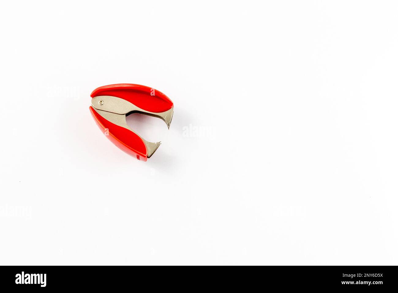 Staple remover on white background high angle view Stock Photo