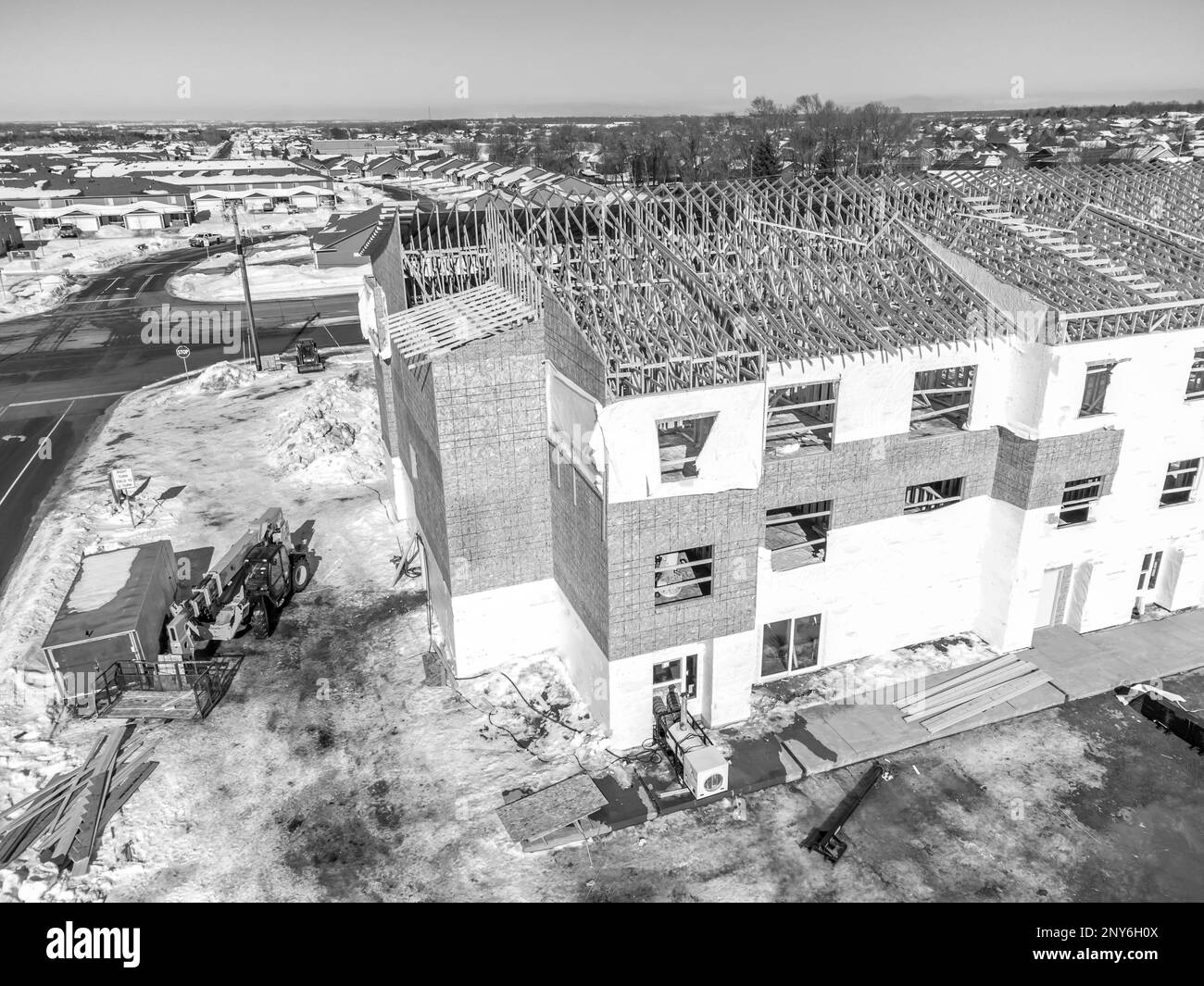 Aerial drone view of a multifamily apartment complex under construction