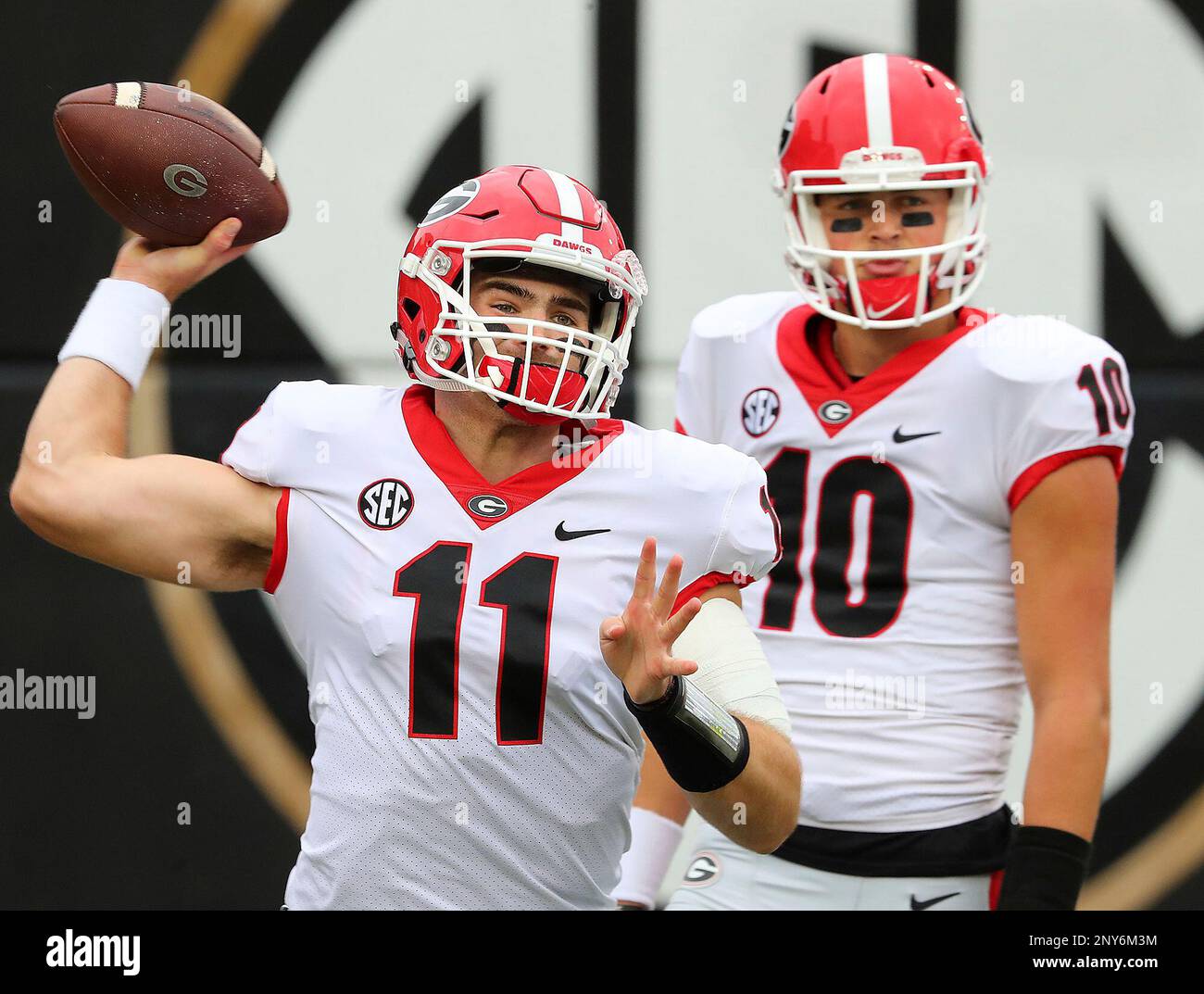 quarterbacks Jake Fromm (11) and Jacob Eason warmup before