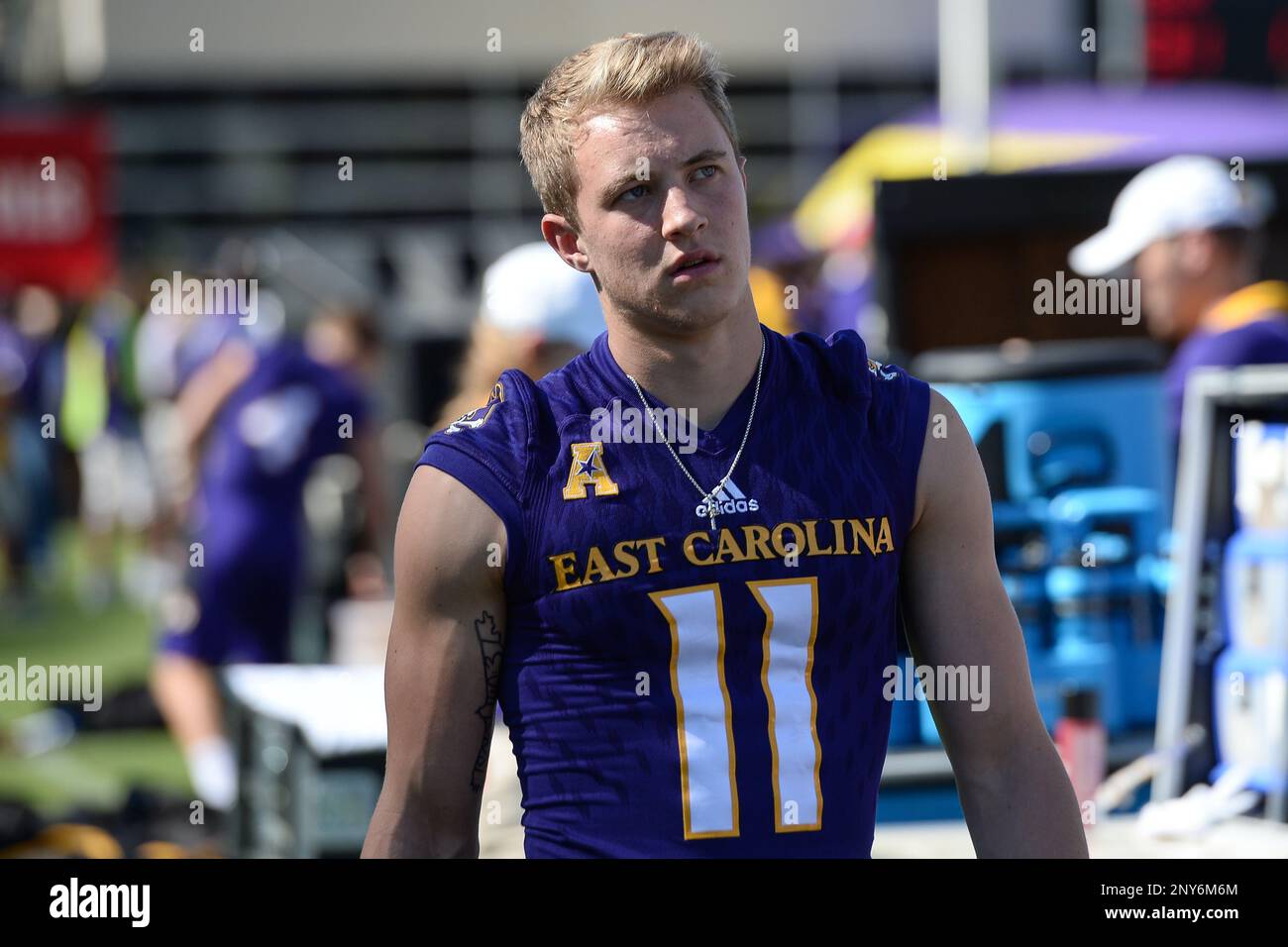 GREENVILLE, NC - SEPTEMBER 30: East Carolina Pirates quarterback Thomas  Sirk (10) runs with the ball during a game between the South Florida Bulls  and the East Carolina Pirates at Dowdy-Ficklen Stadium