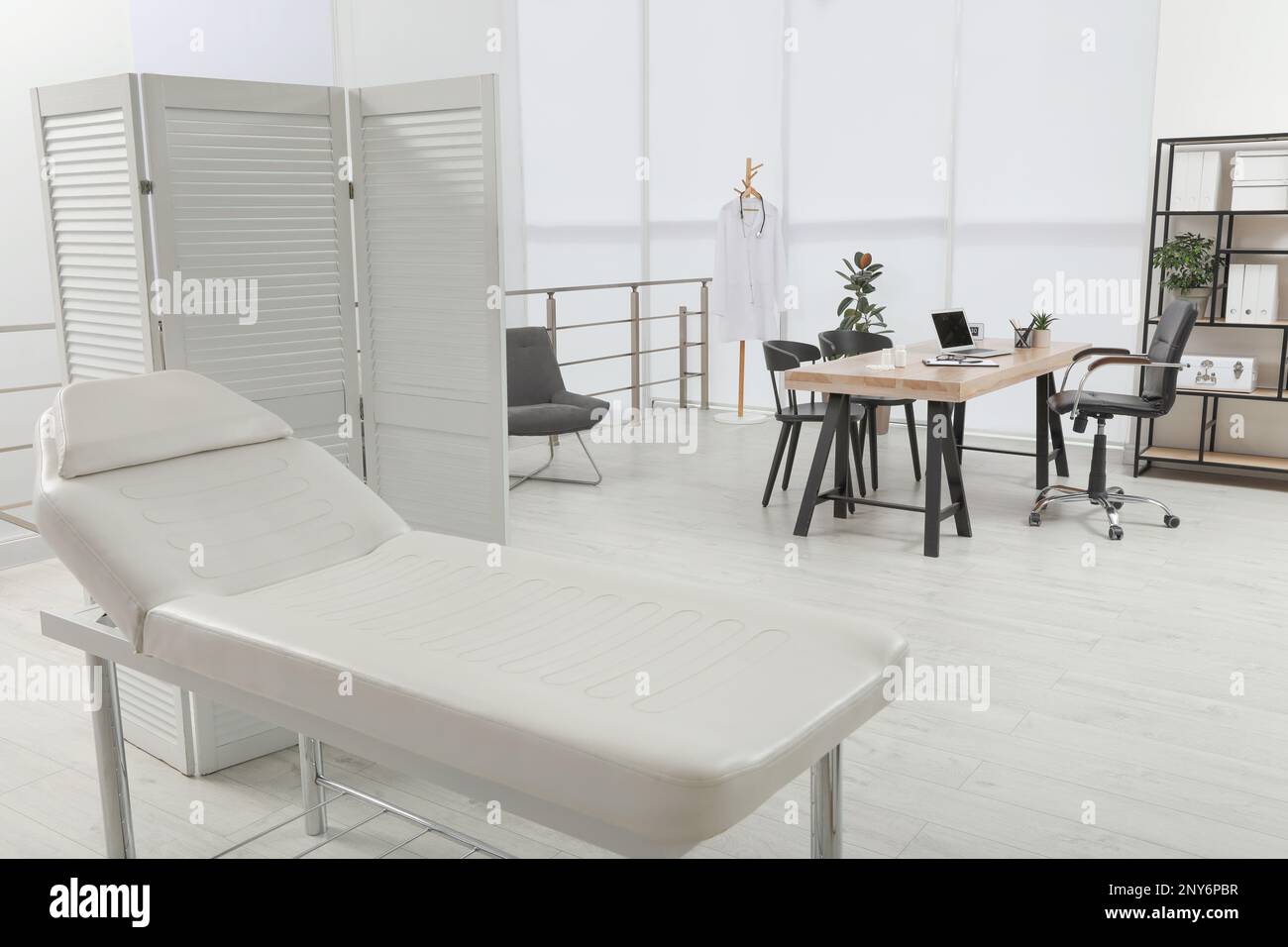 Modern medical office interior with couch. Doctor's workplace Stock Photo Alamy