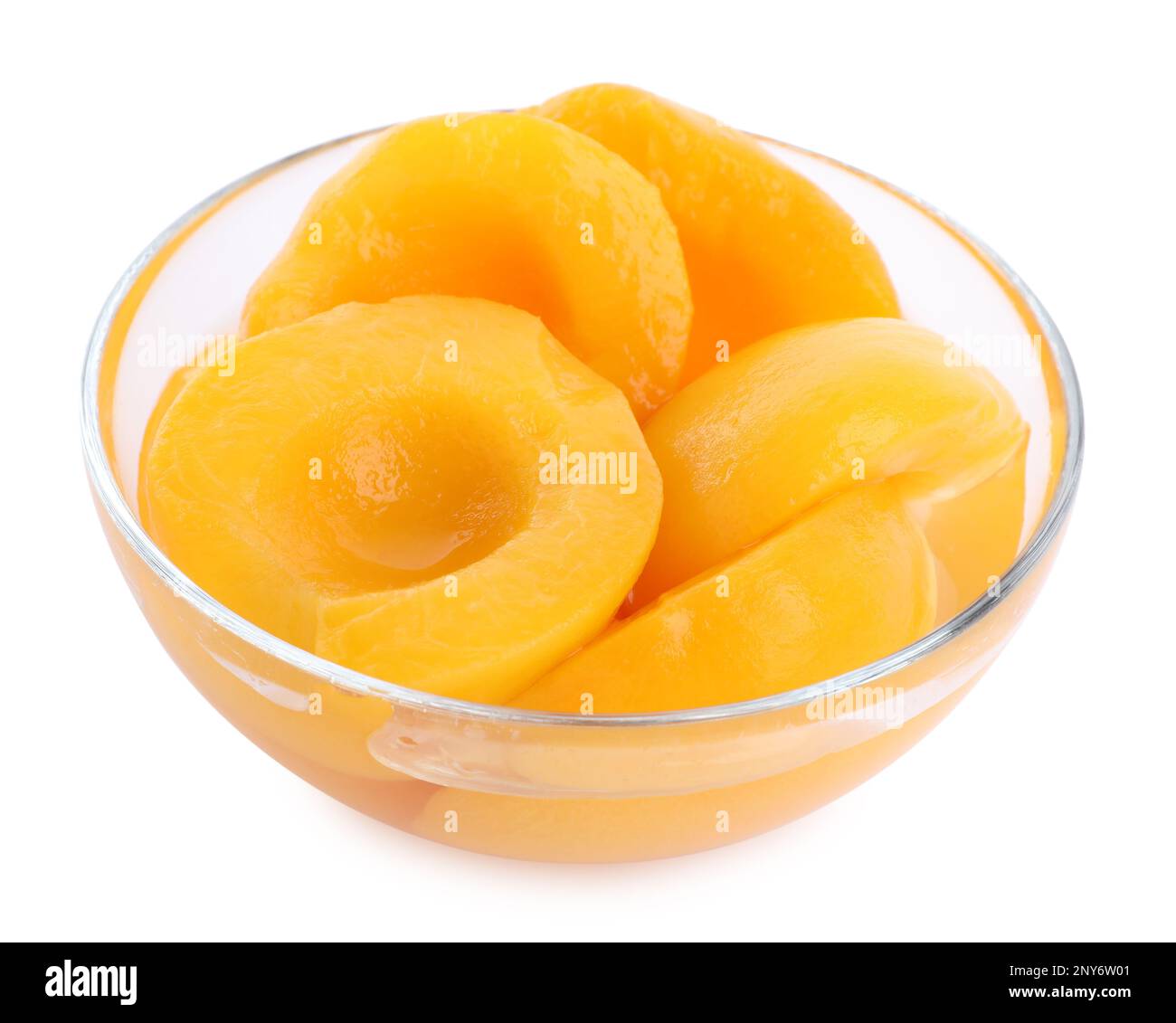 Halves of canned peaches in bowl isolated on white Stock Photo Alamy