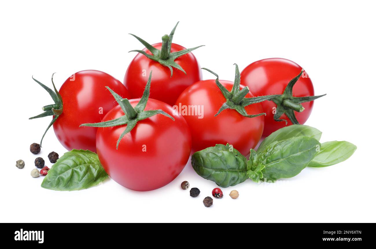Fresh green basil leaves, spices and tomatoes on white background Stock ...