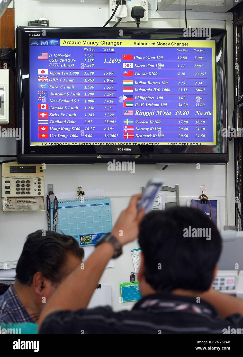 Money Changer At The Arcade With A Screen Showing The Exchange Rates Of money-changer-at-the-arcade-with-a-screen-showing-the-exchange-rates-of