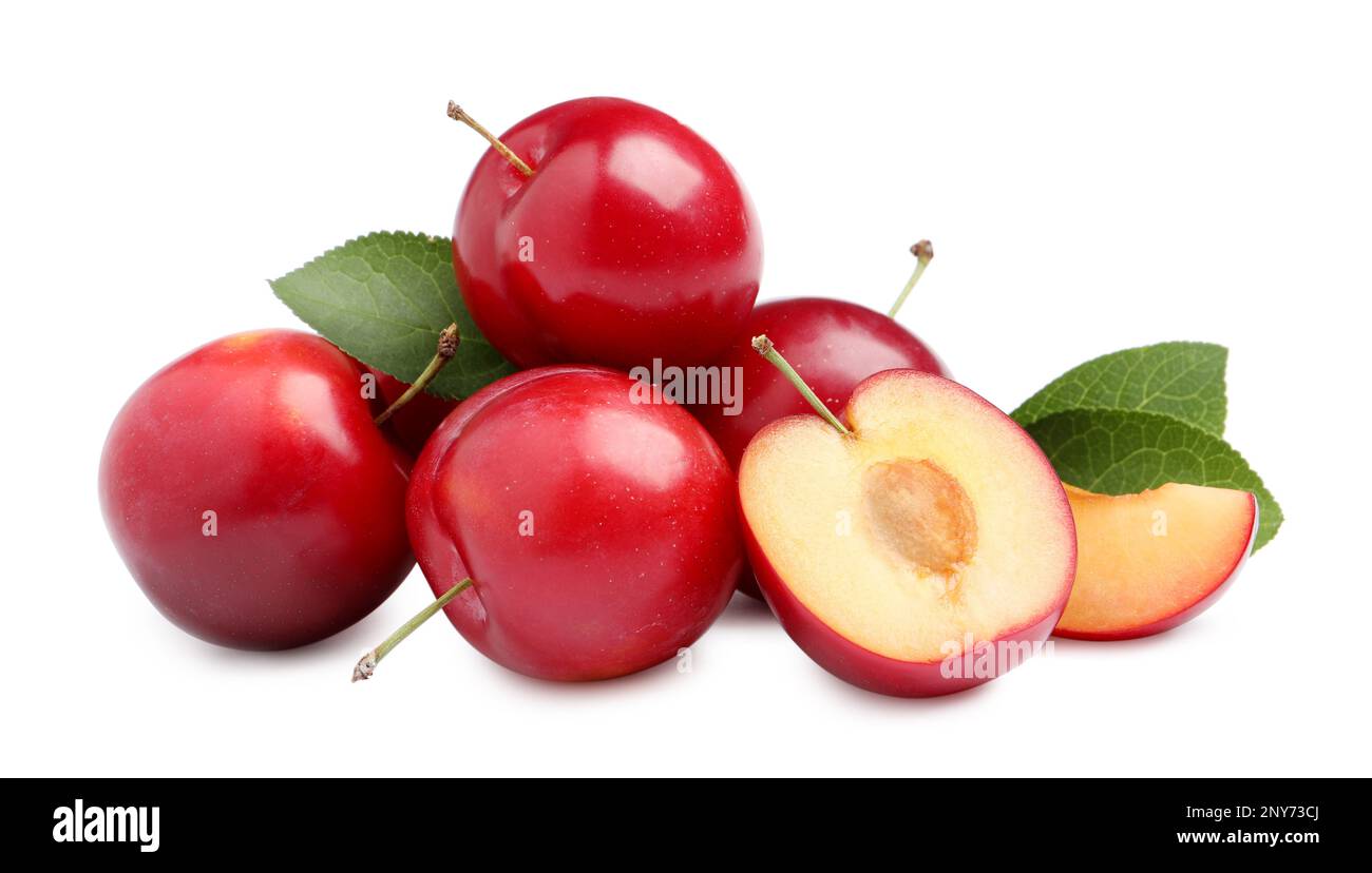 Cut and whole cherry plums with leaves on white background Stock Photo