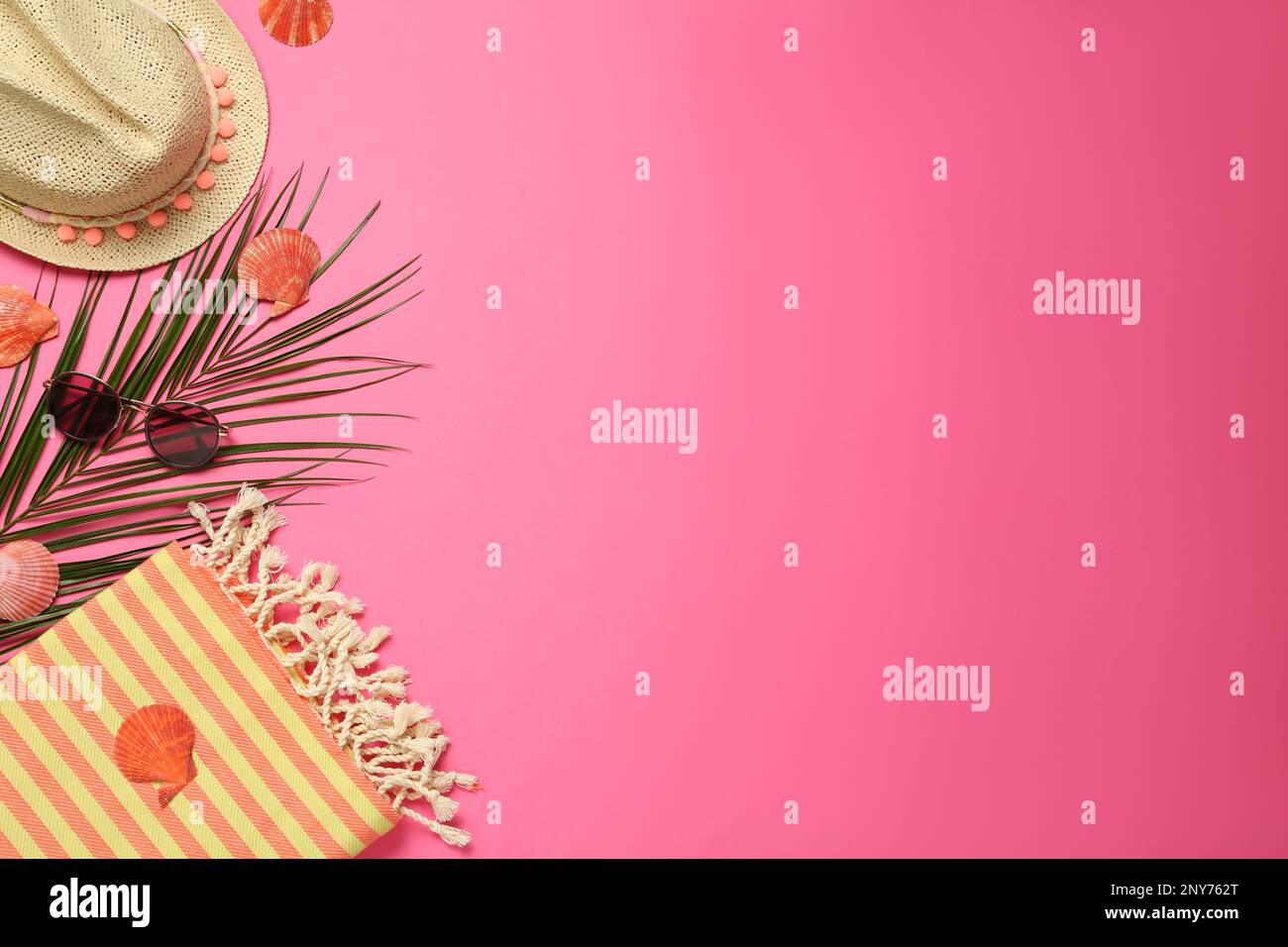Flat lay composition with different beach objects on pink background, space for text Stock Photo