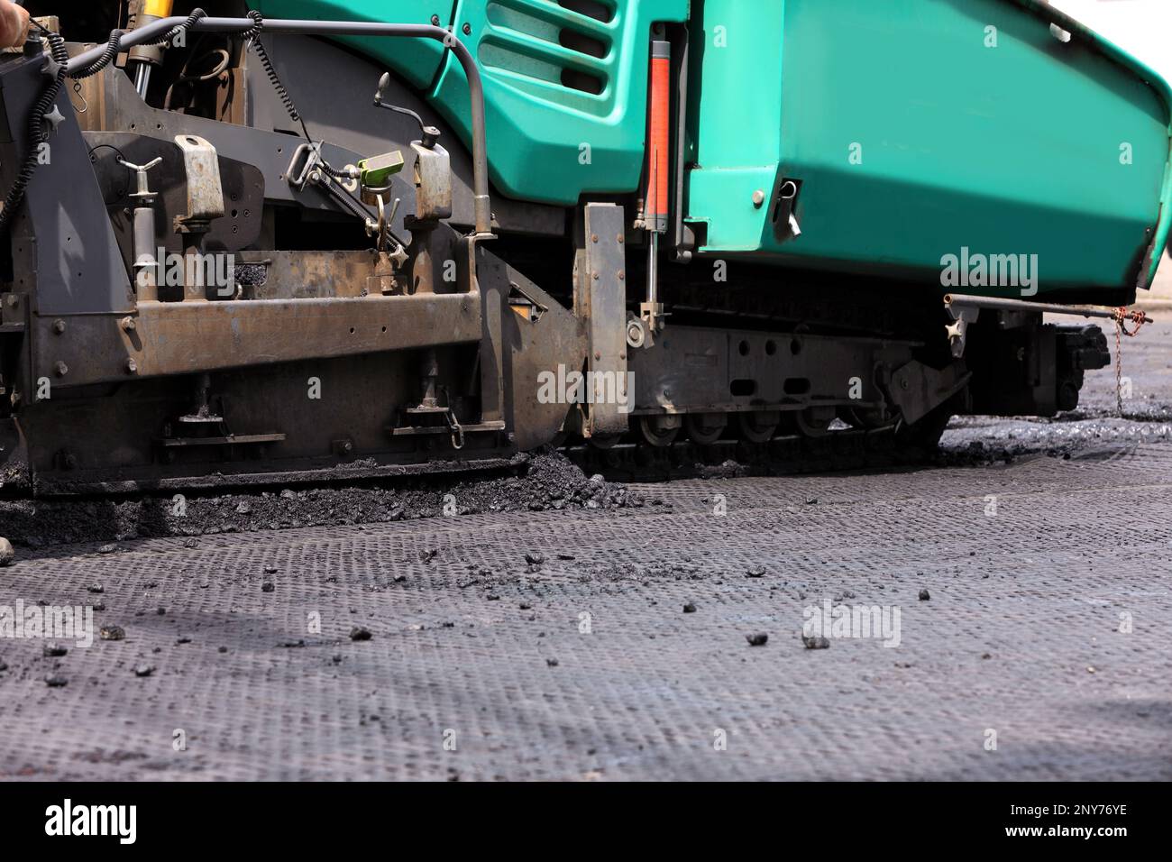 Asphalt paver working on street, closeup. Road repair Stock Photo - Alamy