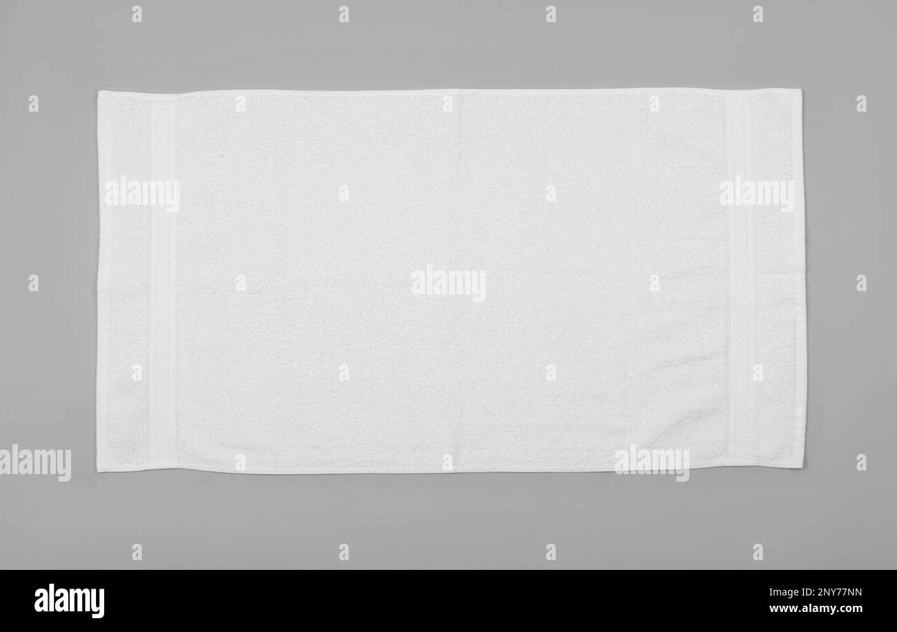 White beach towel on light grey background, top view Stock Photo