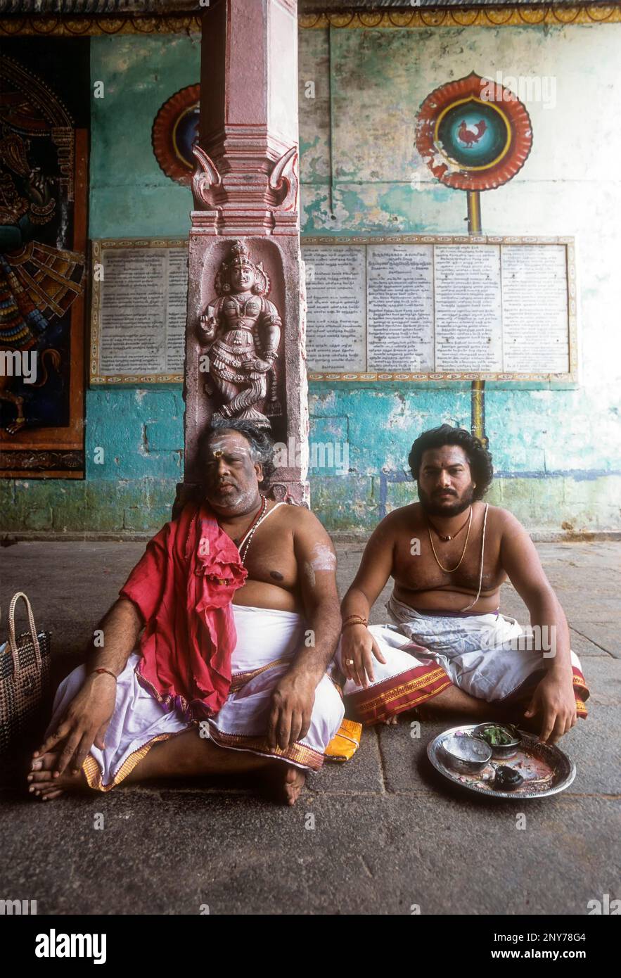 Priest sitting in the corridor of the Vaitheeswaran Temple, Temple for Mars Planet, Tamil Nadu, India Stock Photo