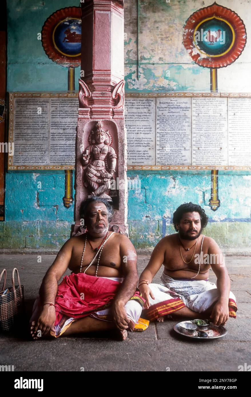 Priests sitting in the corridor of Vaitheeswaran Temple, Tamil Nadu, India. Temple for Mars planet Stock Photo