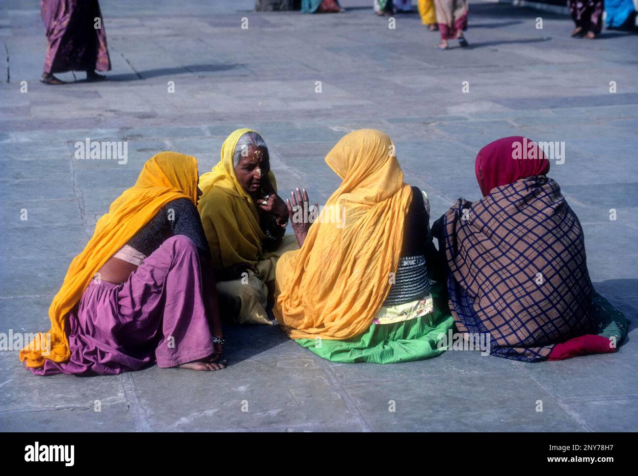 Devotees sitting Radhakrishna temple in Jaipur, Rajasthan, India Stock Photo