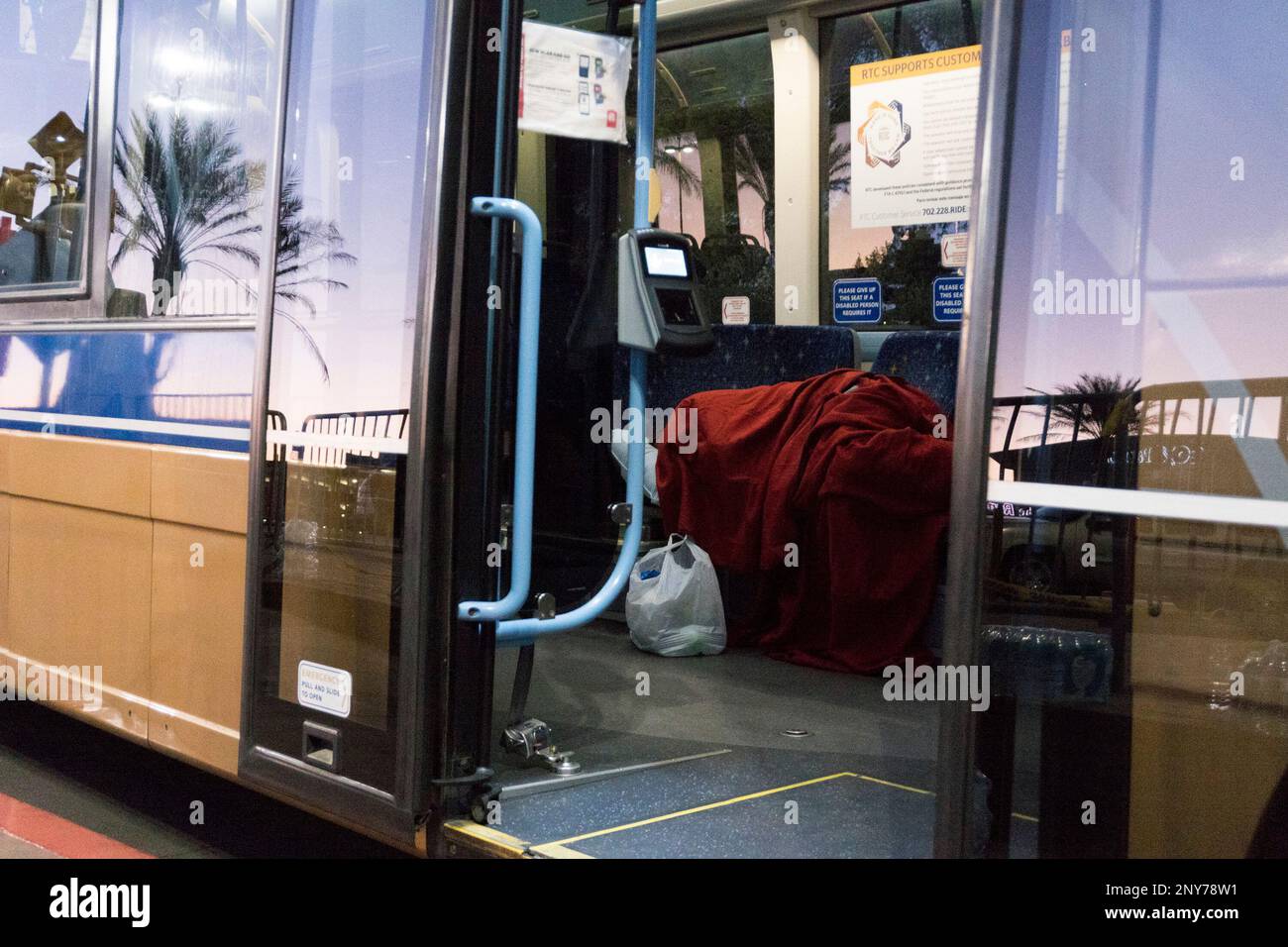 Inside Rtc Front Bus A woman sleeps inside an RTC bus parked outside the Thomas & Mack ...