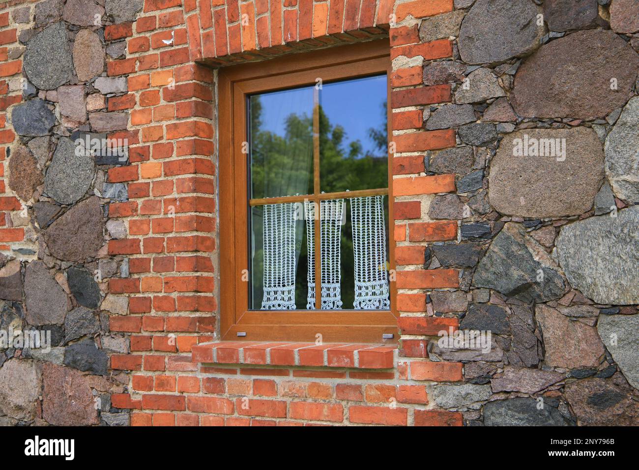 An old window with garden in the historic village Ihlow, federal State Brandenburg - Germany Stock Photo