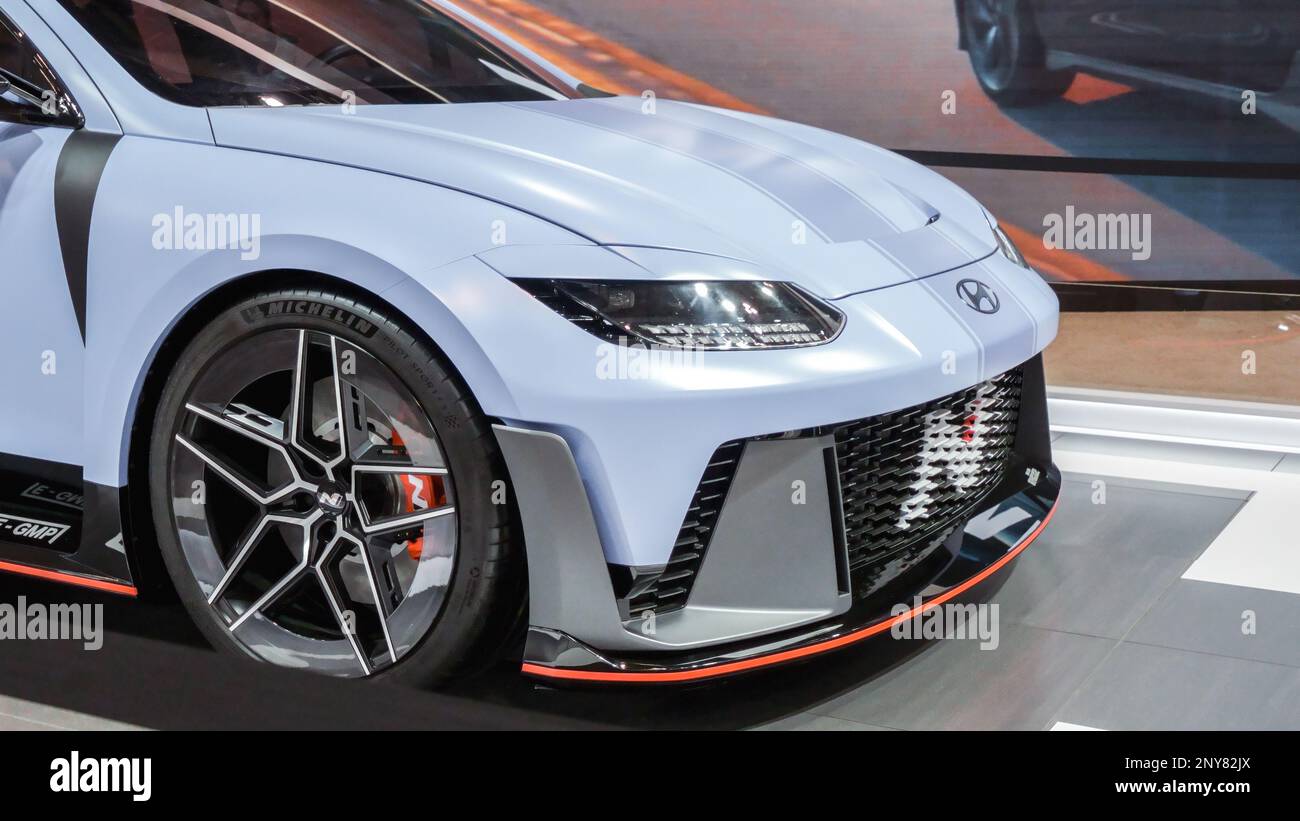 Hyundai RN22e electric car on display. Crowds looking at new car models at Auto show. National