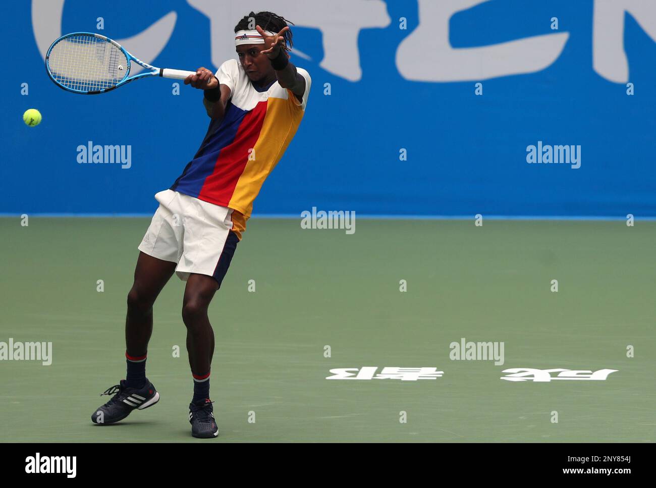 Mikael Ymer of Sweden returns a shot to Lu Yen-hsun of Chinese Taipei in  their first round match of the men's singles during the 2017 Chengdu Open  ATP World Tour at Sichuan