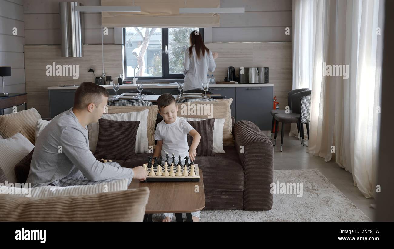 Young family spend time together at home. Action. Mother making ...