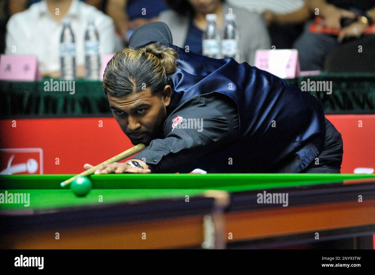 Hammad Miah of England plays a shot to Ding Junhui of China in their Qualifying match of the 2017 World Open snooker tournament in Yushan county, Shangrao city, east Chinas Jiangxi province,