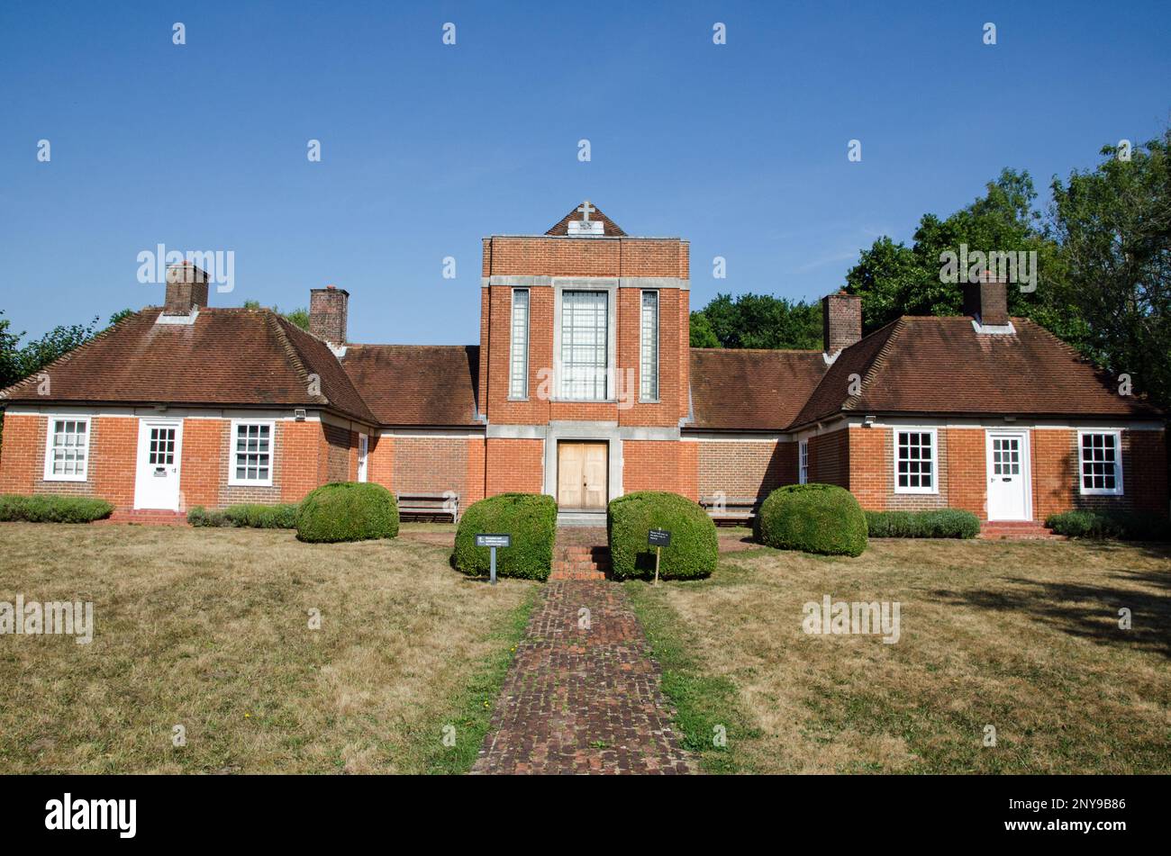View of the facade of the historic Sandham Memorial Chapel in Burghclere, Hampshire on a sunny summer day.  The Chapel contains paintings by Stanley S Stock Photo