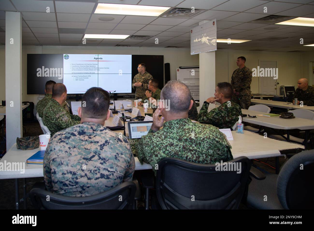 U.S. Marine Corps Maj. Ben Wearing, center, an infantry officer with Expeditionary Operations Training Group, I Marine Expeditionary Force, briefs Colombian military leadership about EOTG tactics during a visit to Marine Corps Base Camp Pendleton, California, Feb. 15, 2023. The visit is designed to reinforce strategic relationships between senior Colombian military and senior Marine Corps leadership. During the visit, Marine Corps leaders briefed senior Colombian leadership about tactical concepts and general strategy. Stock Photo