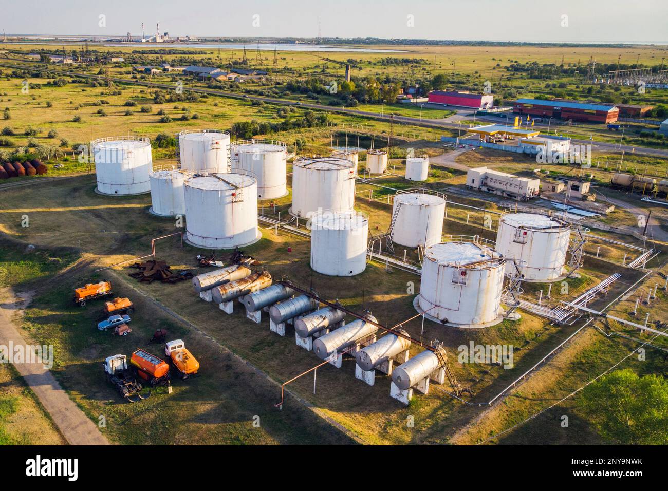 Fuel Storage Tank. Tanks with petroleum products are among the fields near the village. The view from the top. aerial view. Stock Photo