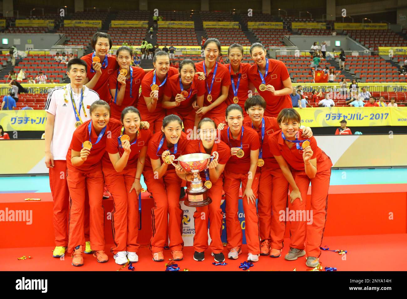 Winner the Chinese women's national volleyball team members pose with their trophy during the