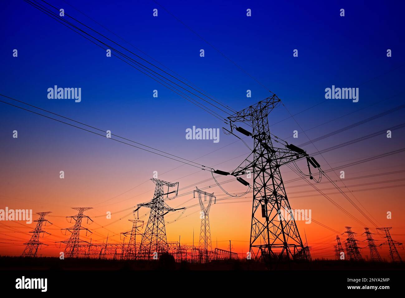 Sunset silhouette of pylon Stock Photo - Alamy