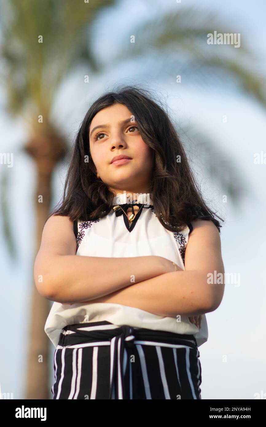 Ambitious girl arms folded looking away outdoors Stock Photo Alamy