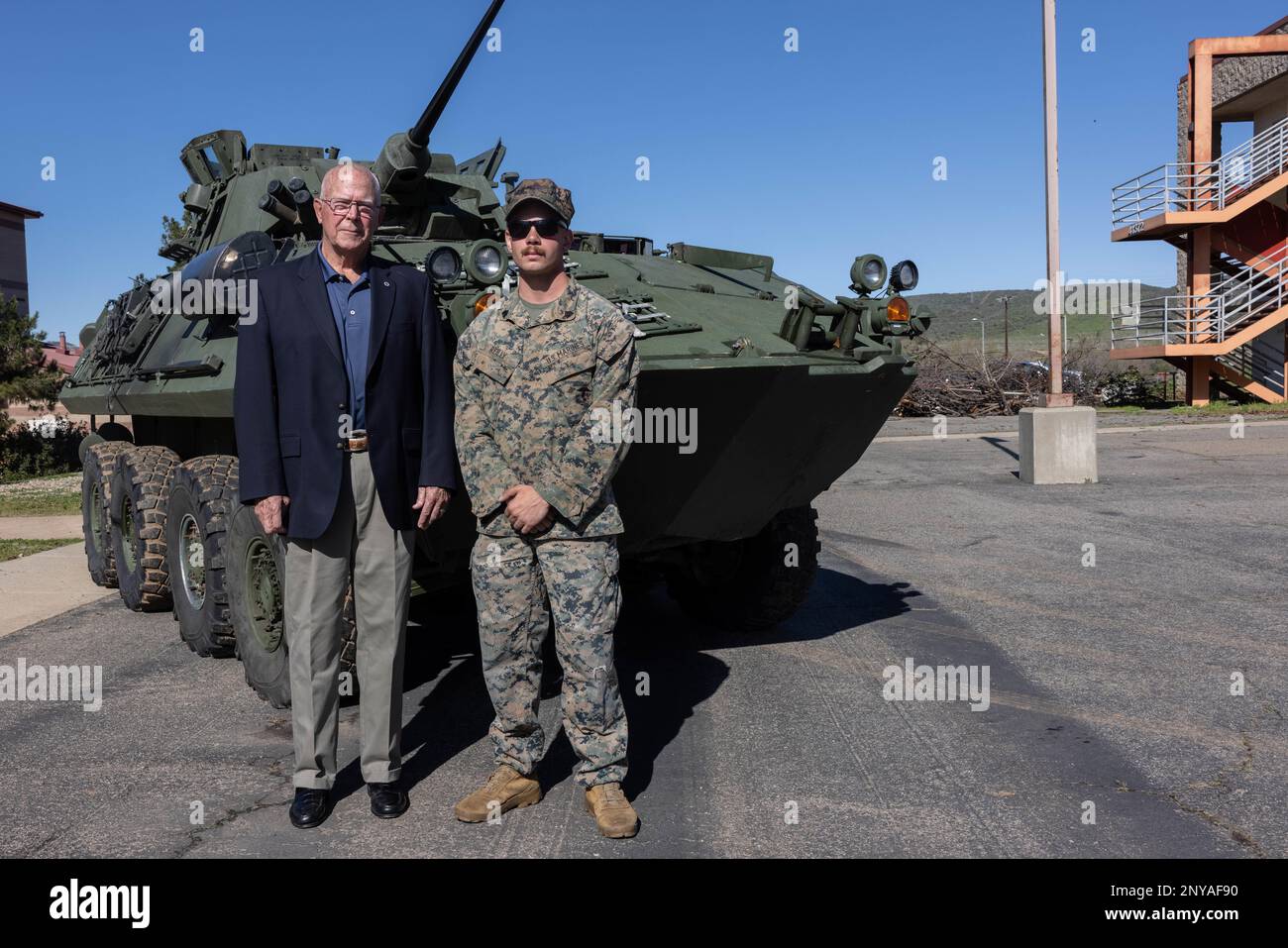 Retired U.S. Marine Col. Clifford Myers and Sgt. Michael Reilly, a section leader with Headquarters and Service Company, 1st Light Armored Reconnaissance Battalion, 1st Marine Division, pose for a photo following a commemorative ceremony for the Battle of Khafji at Marine Corps Base Camp Pendleton, California, Jan. 31, 2023. The Battle of Khafji was the first major ground engagement of the Gulf War, taking place Jan. 29 to Feb. 1, 1991. Myers was the commanding officer of 1st LAR Bn. during the battle. Stock Photo