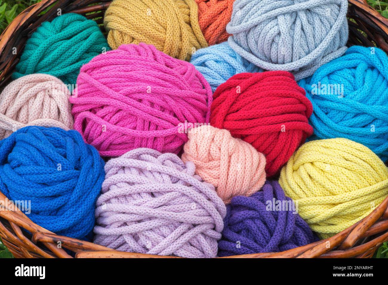 Colorful knitting wool balls in a wicker basket Stock Photo Alamy