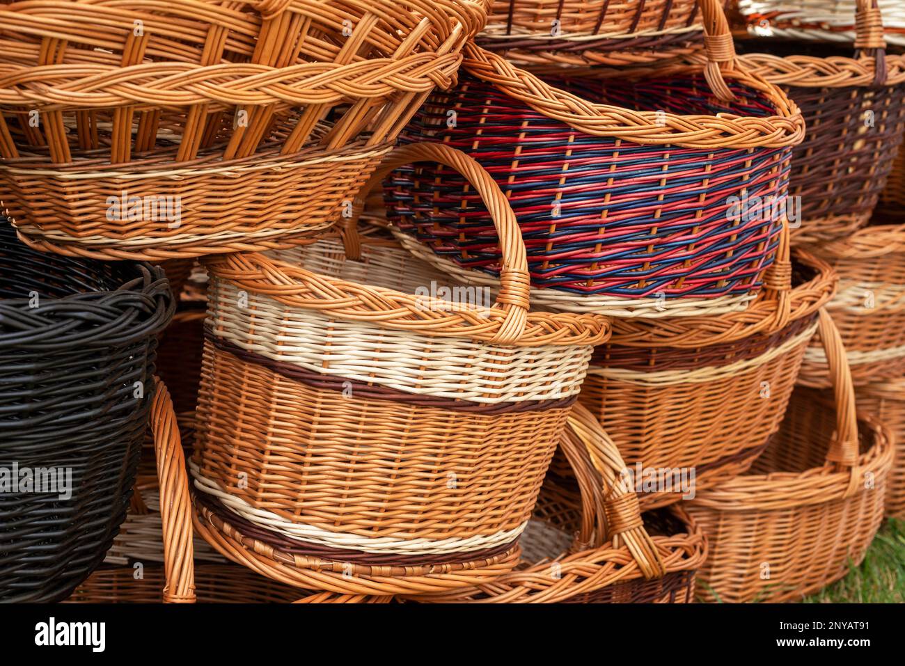 Stack of differentshaped wicker baskets. The handmade DIY baskets on