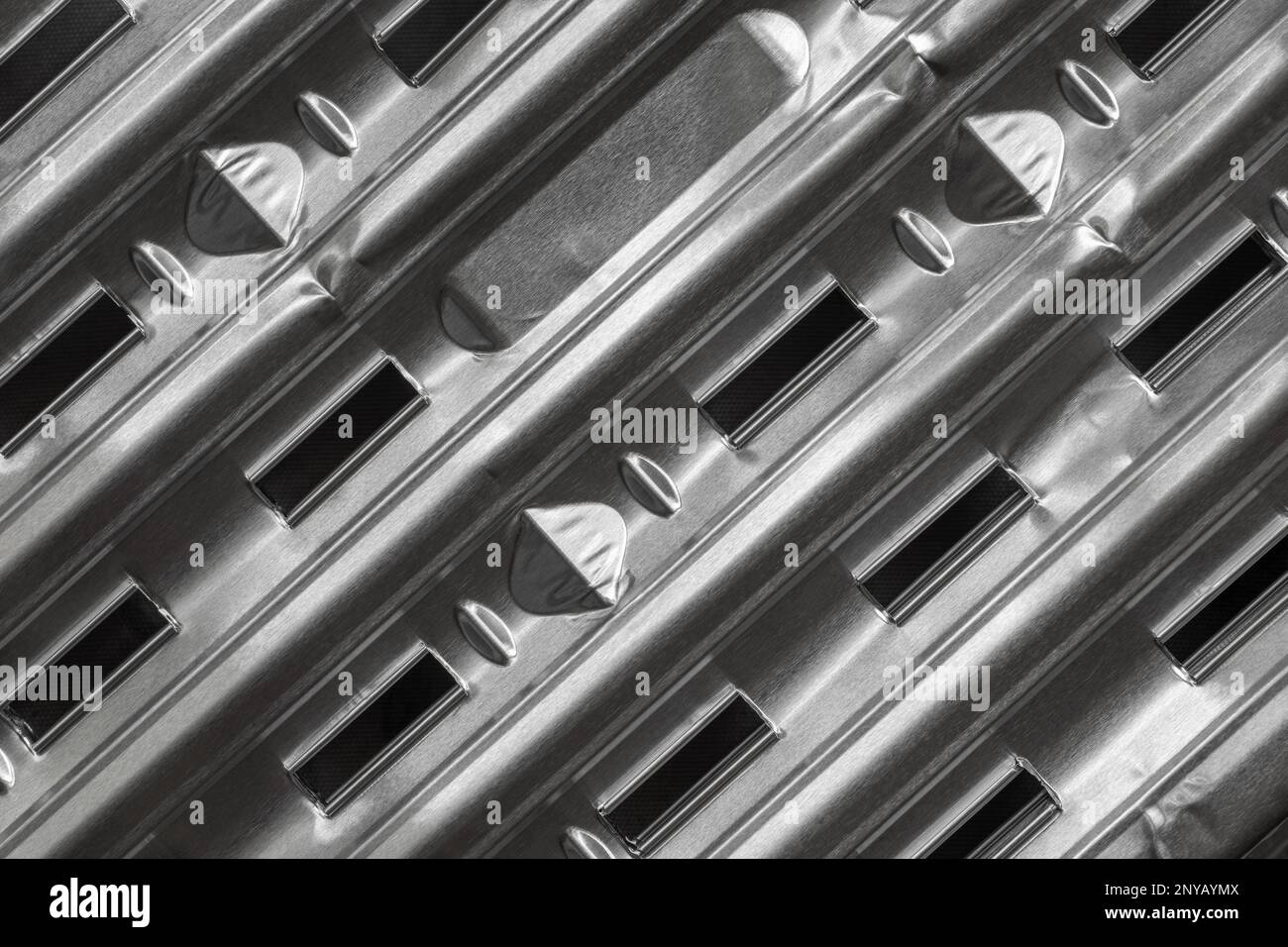 Barbecue pan with a ribbed texture and air slits. A fragment of the