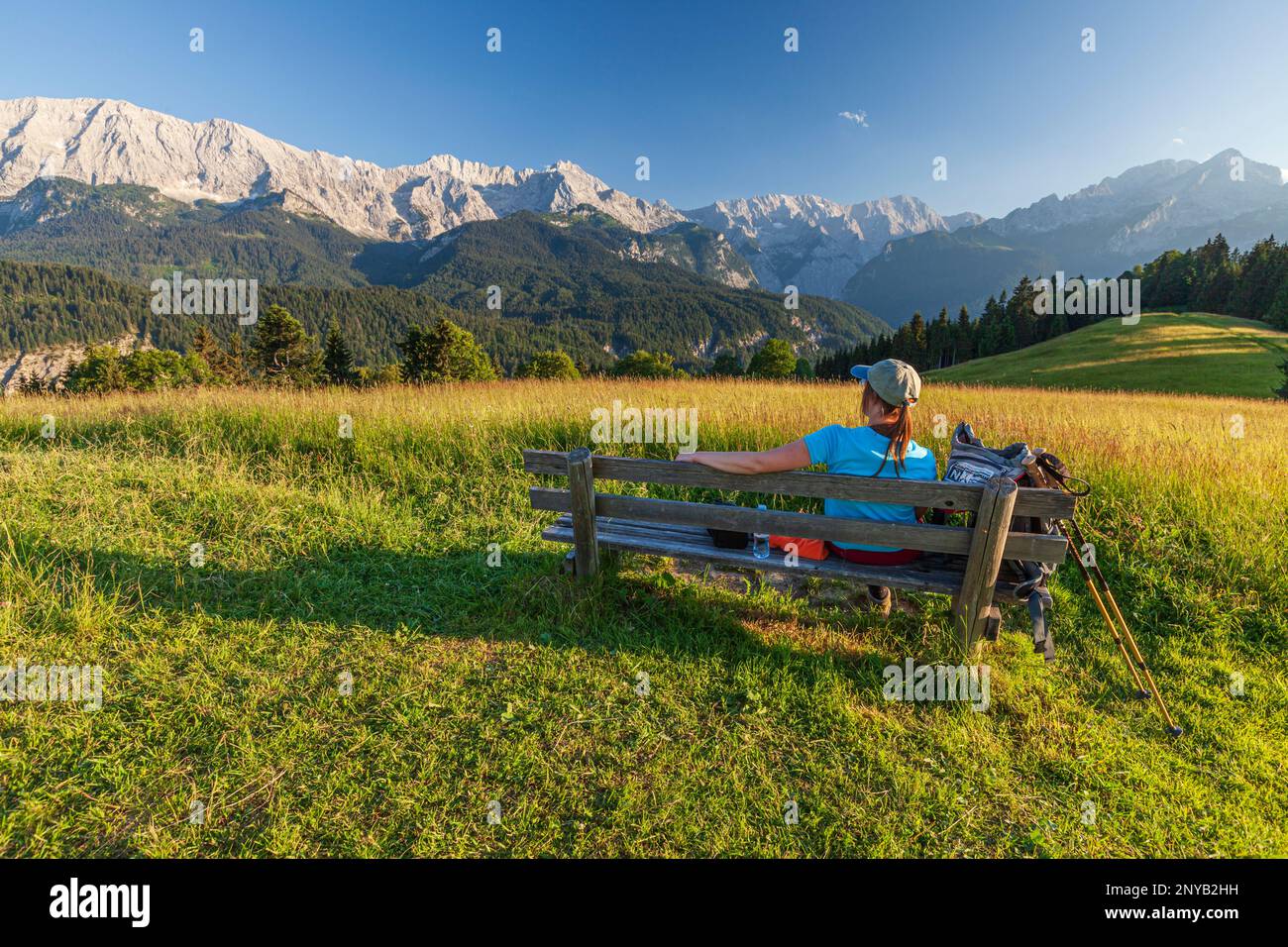 Woman, bench, hiking, Eckbauer, Garmisch Partenkirchen, Wetterstein Mountains, Upper Bavaria, Bavaria, Germany, Europe Stock Photo